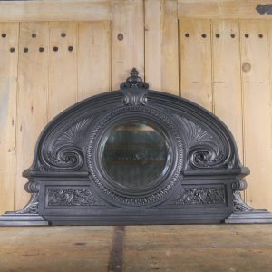 Antique Cast Iron Overmantle With A Round Mirror